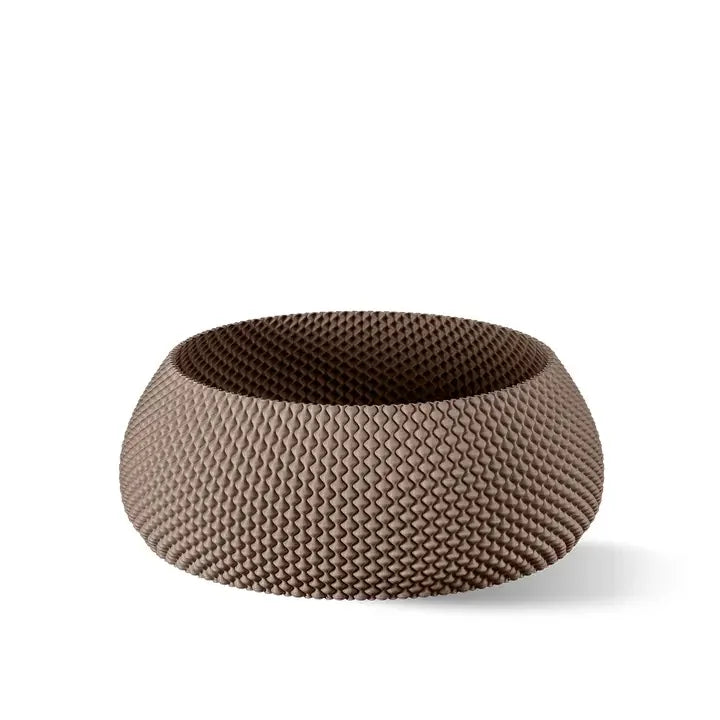 Eine strukturierte, runde braune Schüssel mit modernem Design, einem wellenförmigen Oberflächenmuster und einer breiten, offenen Oberseite.
